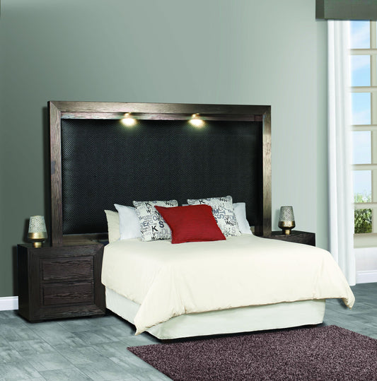 A brown Montego headboard with built-in pedetals in a bedroom setting.